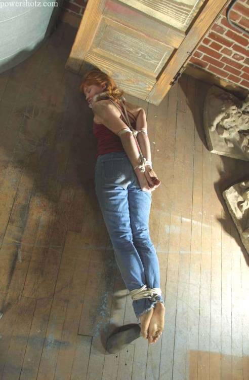 zippo077:  Abducted off the street and kept in a grimy warehouse before being shipped overseas, Katherine makes a desperate attempt to escape. In her struggles she  only succeeds in losing her flip flops and getting filthy from rolling around on the