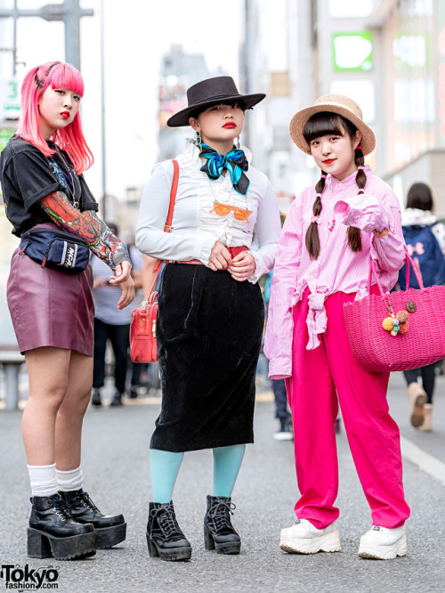 Japanese high school students Mawoni, Rumpa, and Miori on the street in Harajuku wearing a mix of vi