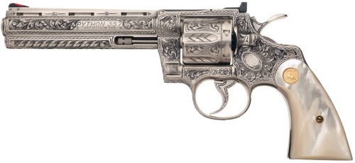 twippyfan:  Engraved Colt Python .357 with pearl grips and gold medallion.