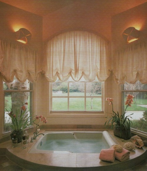 vintagehomecollection - A sunken whirlpool tub provides both...