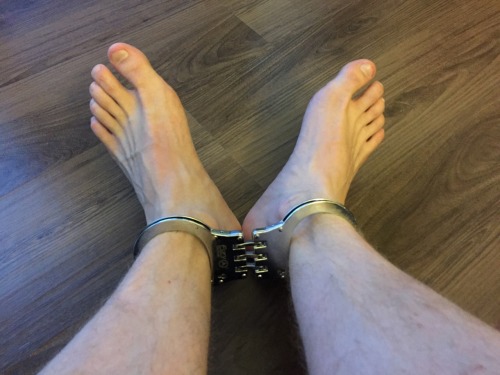 lockedandbound:  Somehow never realized before that I could get my ankles into handcuffs. This will open up some new possibilities…