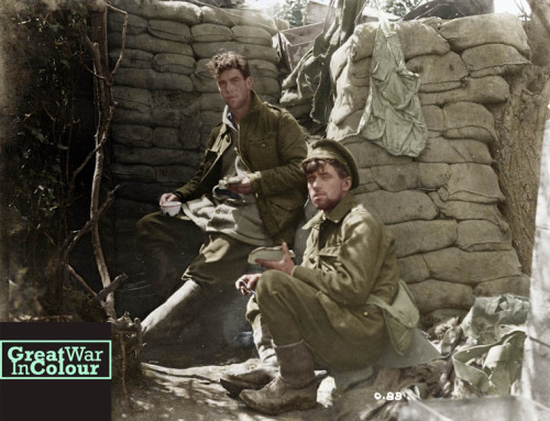 greatwarincolour:  Candid photograph of two Canadian soldiers eating lunch on the front line.Photogr