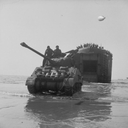 m4a1-shermayne:     A Sherman Firefly coming ashore from an LST (Landing Ship Tank), Sword Beach, 7 June 1944.   