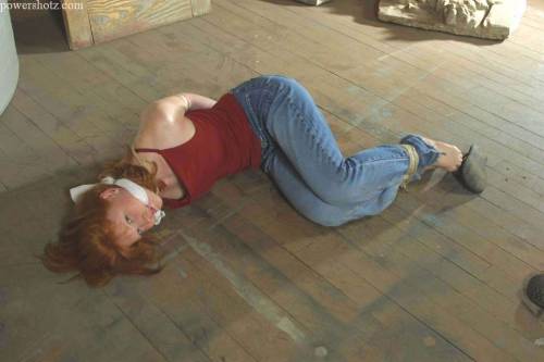 zippo077:  Abducted off the street and kept in a grimy warehouse before being shipped overseas, Katherine makes a desperate attempt to escape. In her struggles she  only succeeds in losing her flip flops and getting filthy from rolling around on the
