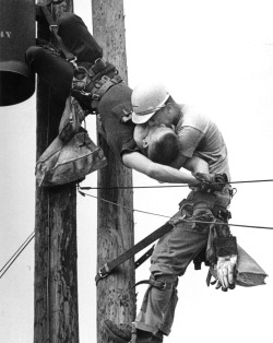  Kiss of Life. Utility worker, J.D. Thompson, suspended on a utility pole and giving mouth to mouth resuscitation to a fellow lineman, Randall G. Champion, who was unconscious and hanging upside down after contacting a high voltage line. Rocco Morabito.