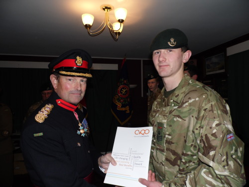 Brig Simon Young CBE presenting the CVQO-led BTEC certificate to Sjt T Lee Parker