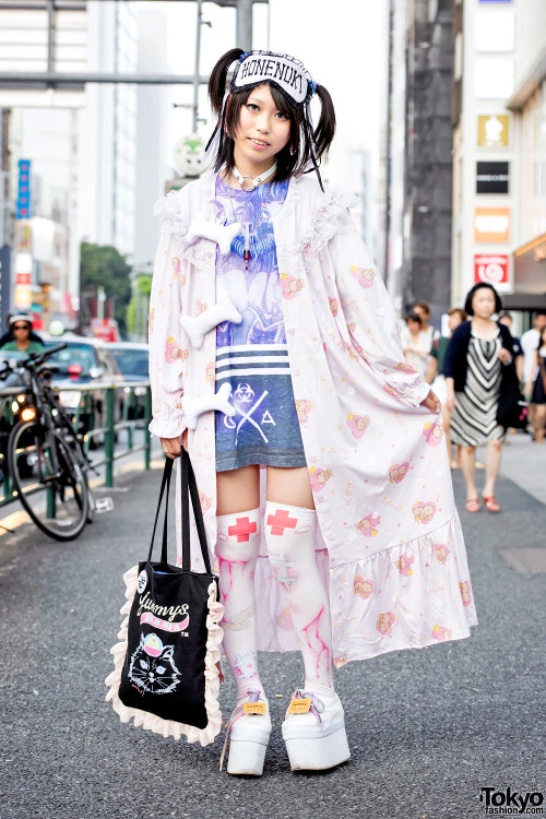 16-year-old Pinkyuamomota on the street in Harajuku wearing a Milklim robe (with plush bones) over a