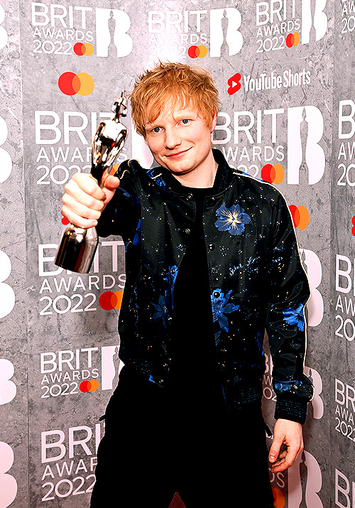 ED SHEERAN poses with his trophy for Songwriter of the Year at the 2022 BRIT Awards (February 8