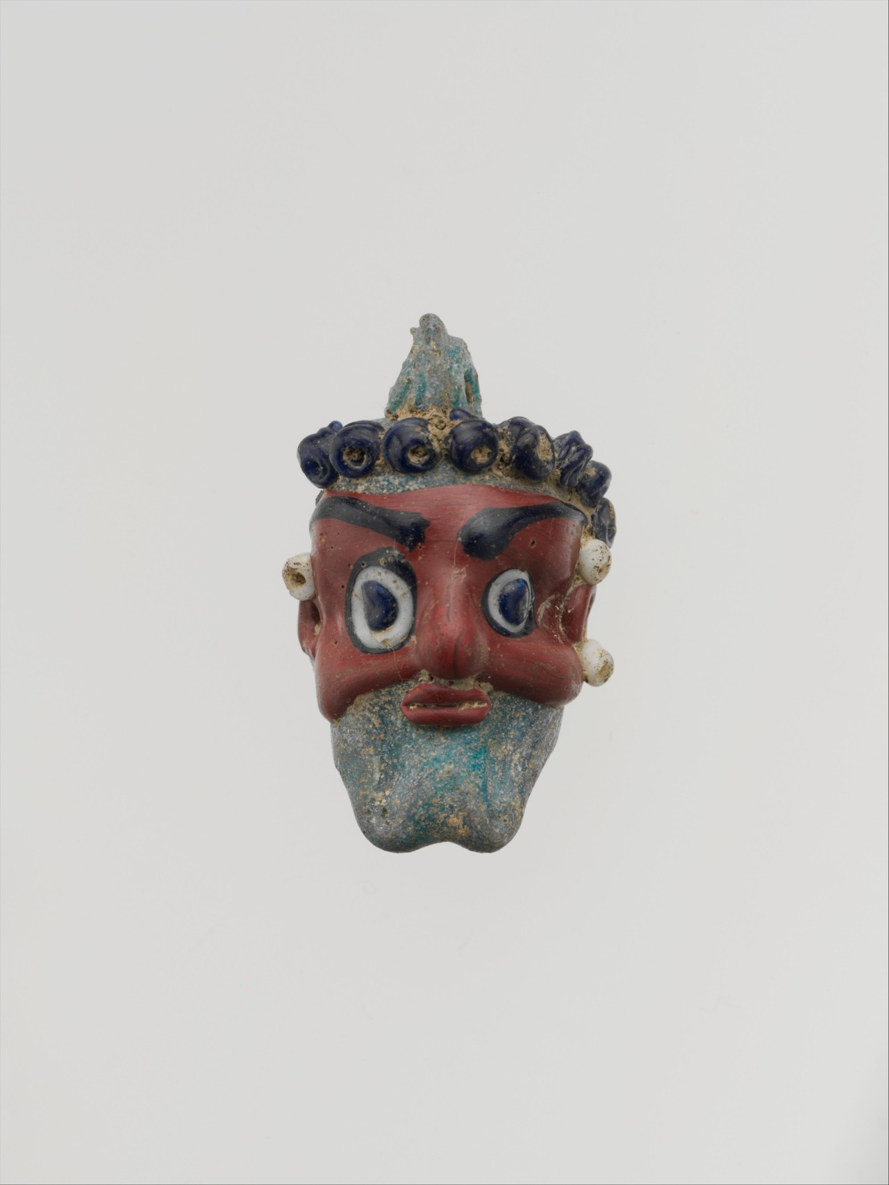 ancientart:  Phoenician or Carthaginian glass head pendants. The first dates to theÂ 5th