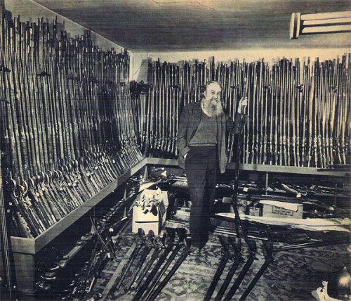 Joe Kindig and his vast collection of antique Pennsylvania and Kentucky Long Rifles, 1955.