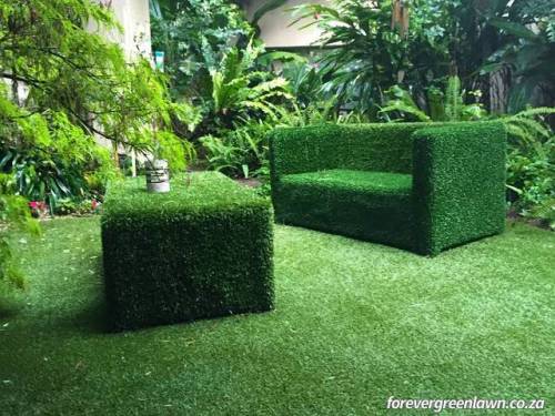 Garden furniture covered with artificial grass.