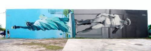 Ozmo in Wynwood district of Miami, USA (the statue of Liberty and Michelangelo’s sculpture of David)