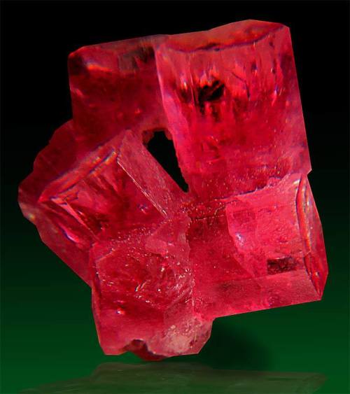 Red Beryl.More common varieties of beryl such as emerald or aquamarine are formed in pegmatites, but