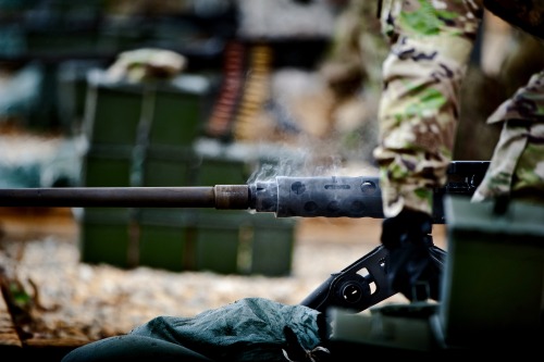 militaryarmament: Trainees firing the Browning M2 from the seated, tripod mounted position as instru