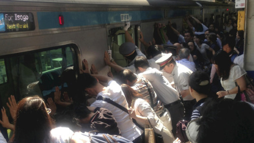 johndarnielle: jhermann: goodstuffhappenedtoday: Japanese commuters push 32-ton train to free wom