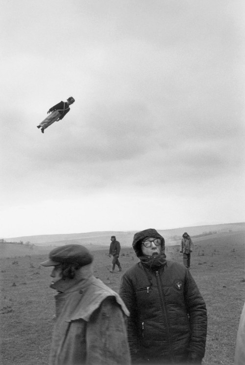 shihlun: American actor-director Woody Allen on a location shoot for the comedy ‘Love and Death’, set during the Napoleonic Wars. Behind him, a dummy soldier flies through the air, supposedly fired from a cannon. Circa 1974Photo by Ernst Haas