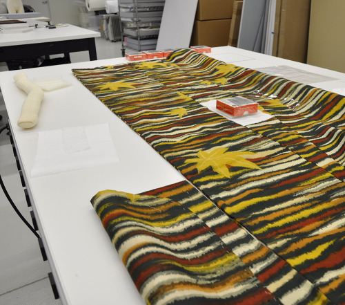 It takes a team of conservators and hours of meticulous preparation and care to get a textile ready 