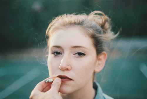 Meghan Braley with Flowers and a Cigarette 