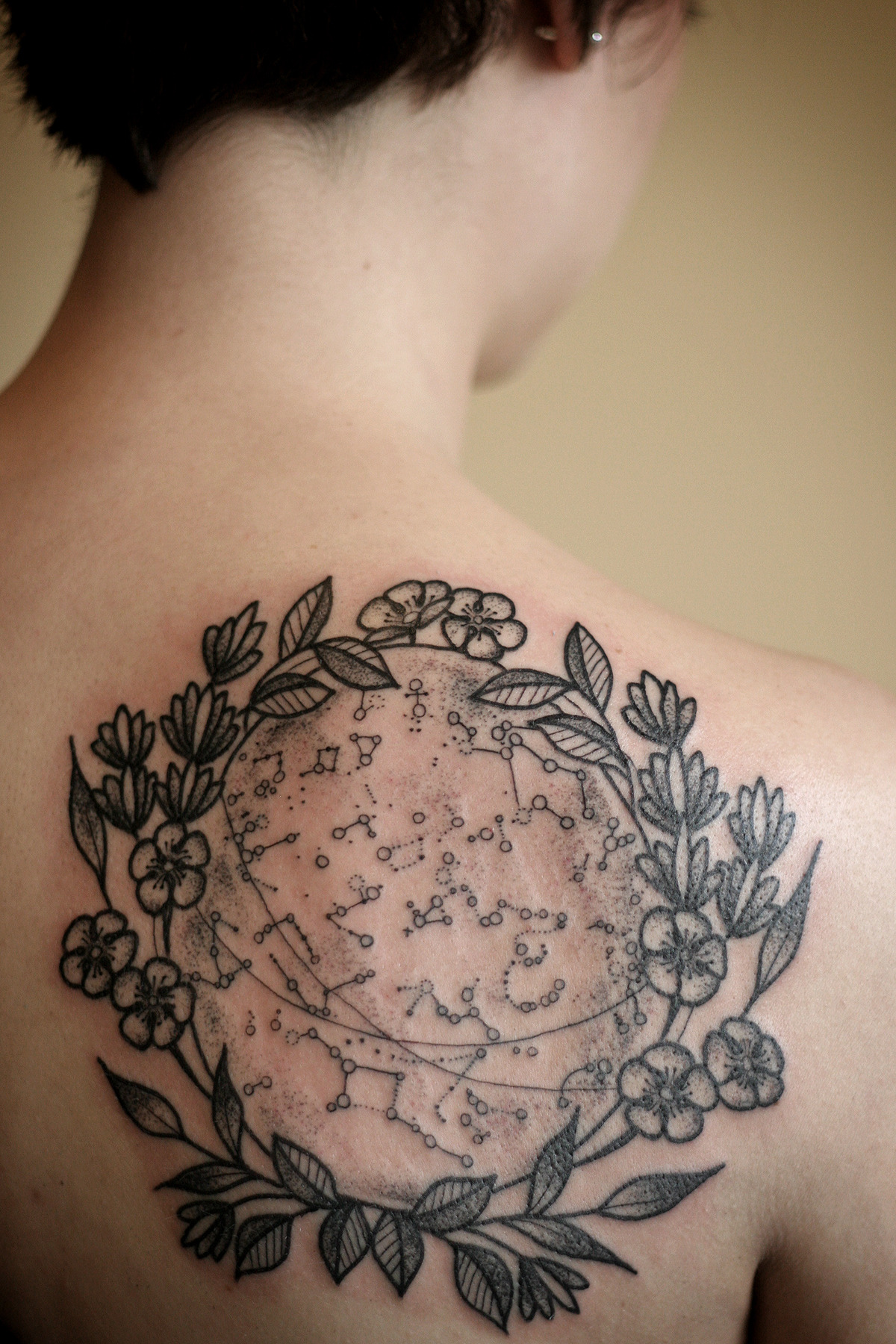 wonderlandtattoospdx:  Constellation map with floral wreath, by Kirsten Holliday