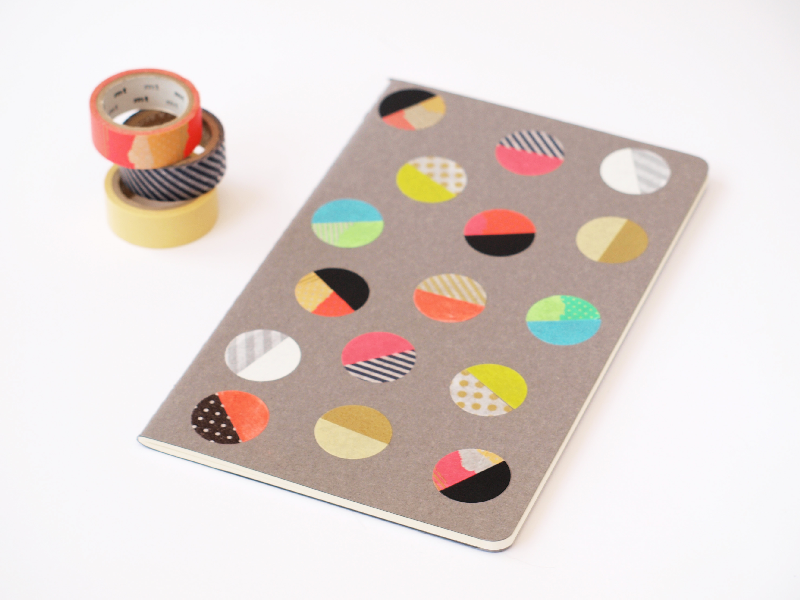unikapparel:  Make a simple and fast notebook cover with colorful washi tape dots.