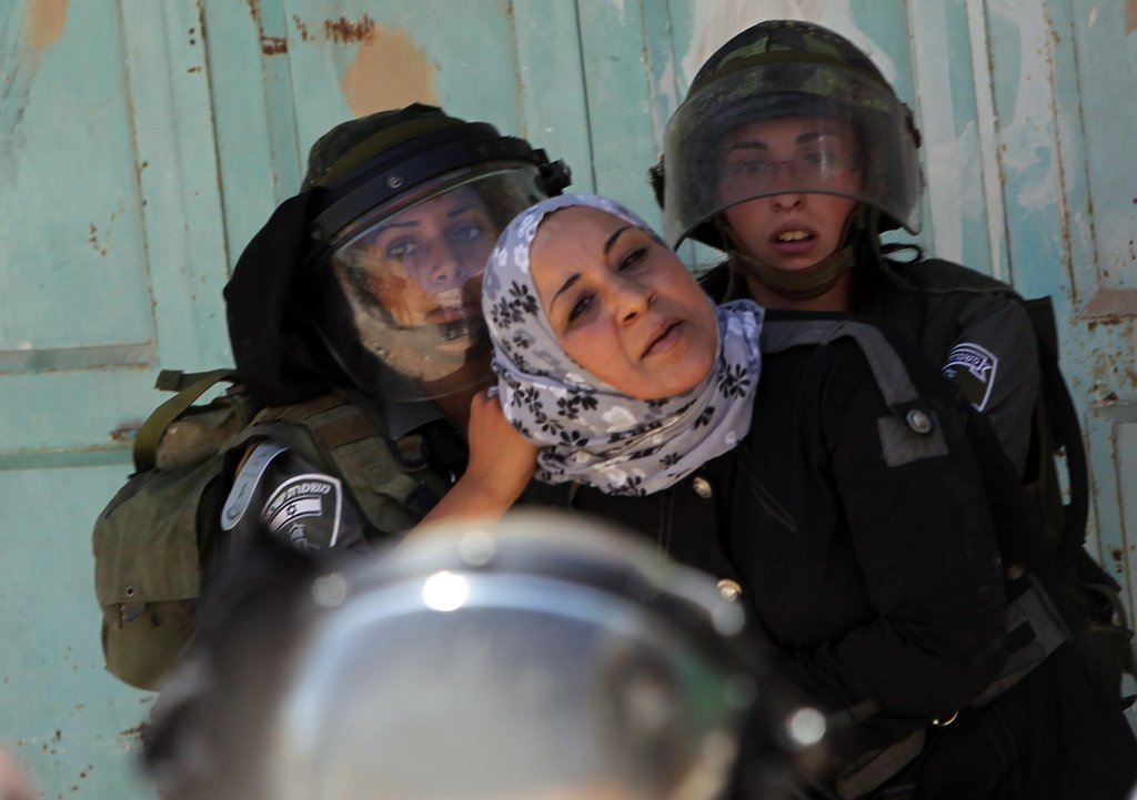 israelfacts:  Israeli officers arrest a Palestinian woman in the Palestinian city