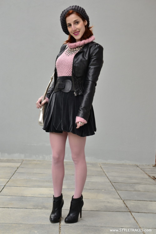 Sheer pink tights, pleated skirt, leather jacket and pink crochet cardigan