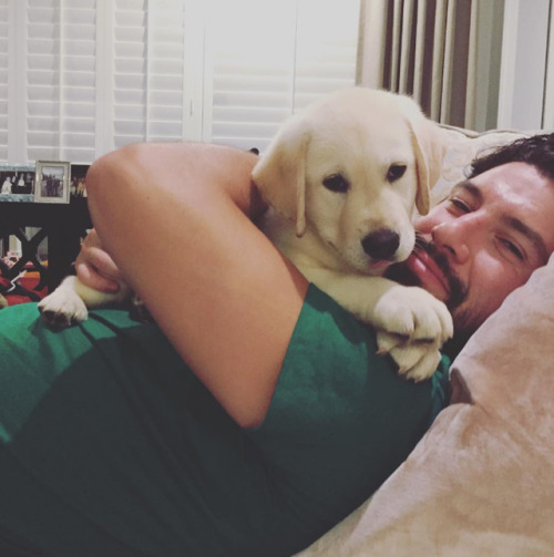 Nate Thompson hugging his puppy, Eddie(Source: instagram.com/good_times_with_eddie)