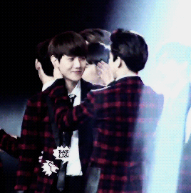 kyungsol: jongin grabbing kyungsoo by the waist what resulted in kyungsoo punching