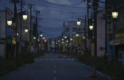 destroyed-and-abandoned:  20,000 people used to live here, now it’s a ghost town. This is Namie, Japan, now inside the nuclear Exclusion Zone created by the Fukushima disaster. The lights are left on to maintain hope of eventually returning to the town.