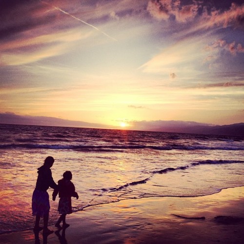 Sunset at Santa Monica pier. With sand between your toes, a magnificent colored sky, and a loved one