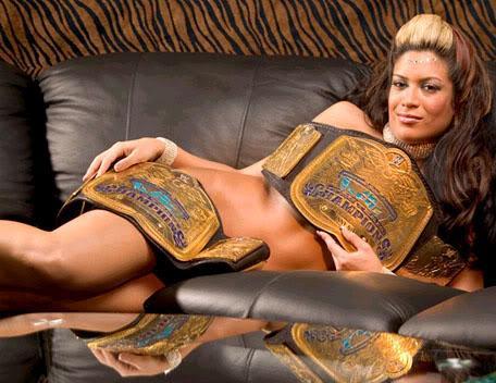 rudeboy308:  shitloadsofwrestling: Melina poses with the WWE Tag Team Championships[October