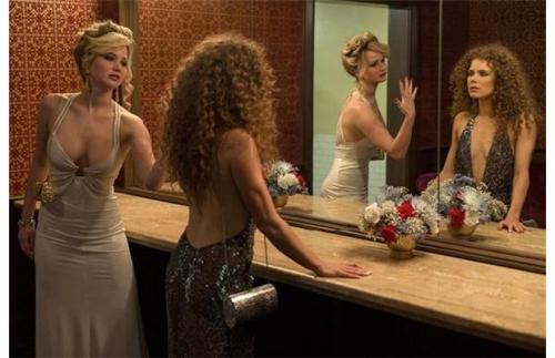 American Hustle, 2013Costume design: Michael Wilkinson silver-blue backless plunge dress with halter