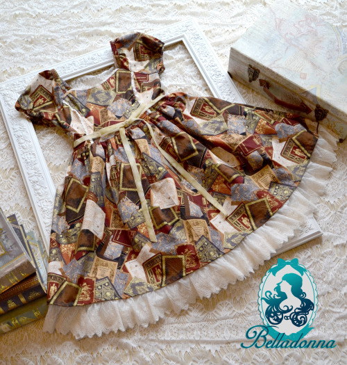  To the Library OP“This dress is made with a rich book fabric with ivory lace accents. It features