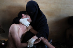 jonyorkblog:  Samuel Aranda of Spain, a photographer working for The New York Times, won the World Press Photo of the Year 2011 with this picture of a woman holding her wounded son in her arms inside a mosque used as a field hospital by demonstrators