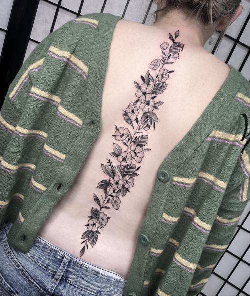 allthepiercingsandbodymods:Flowers spine