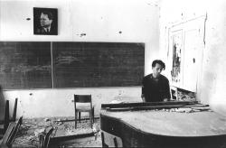 infra-red-demon:   Mostar, Bosnia, September 1992. A Bosnian soldier plays the piano in the destroyed music school.Photo by Teun Voeten.  