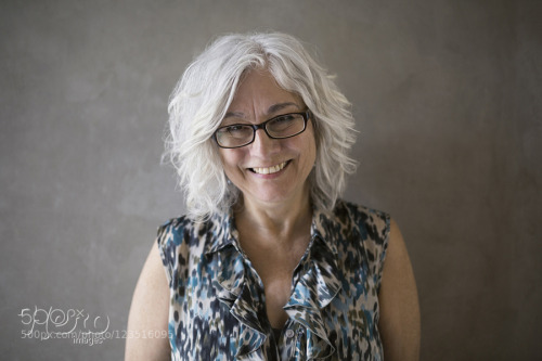 Portrait confident businesswoman with gray hair and eyeglasses