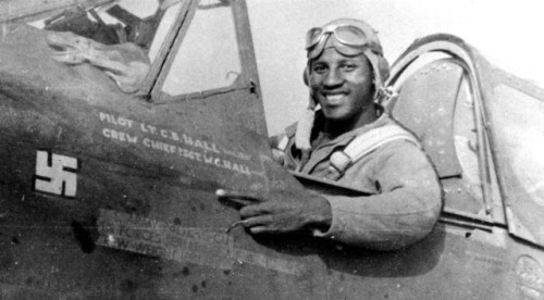 historium:Tuskegee Airman Charles B. Hall proudly pointing to the first swastika on his P-40. He dow