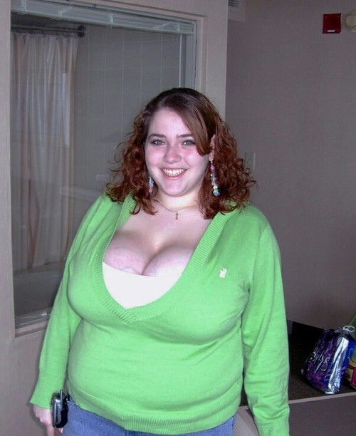 Busty BBW In Green And White Top &amp; Blue Jeans Smiling.
