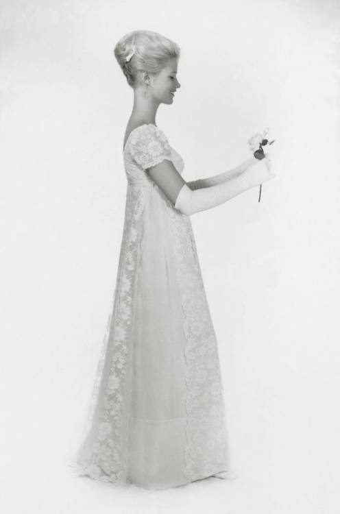 Mazie Cox poses for a picture in a dress which her mother designed for her for her ball.