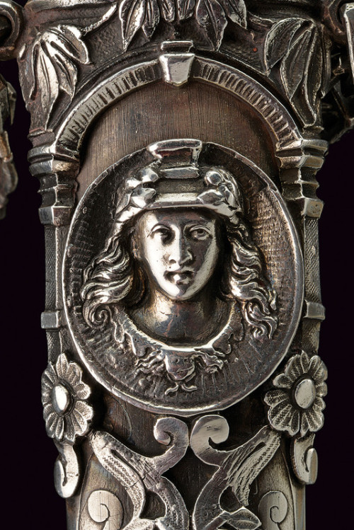 art-of-swords:  “Heroic Style” Silver Mounted DaggerDated: 19th centuryCulture: EuropeanMeasurements: height 64cmThe dagger has a straight, double-edged blade with three fullers. The massive, silver hilt has its the grip worked as the in-the-round