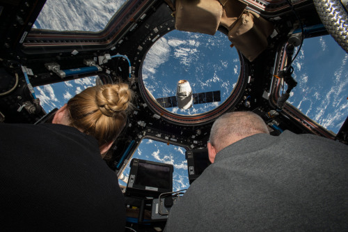 Capturing a DragonNASA astronauts Kate Rubins (left) and Jeff Williams (right) prepare to grapple th