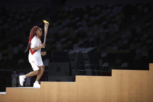 ctolisso:  Naomi Osaka carries the Olympic Torch and lights the Olympic cauldron during the opening ceremony in the Olympic Stadium at the 2020 Summer Olympics, Friday, July 23, 2021, in Tokyo, Japan.