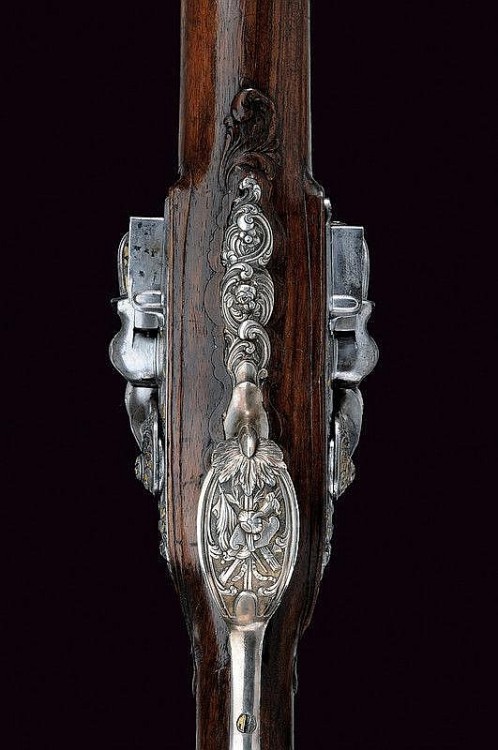 A lovely gold inlaid double barrel flintlock rifle originating from Paris, 18th century.
