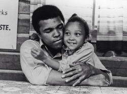 masgid:   Ali with his daughter Maryum, 1974 