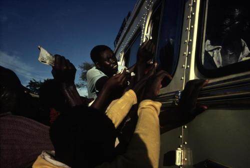 thesoulfunkybrother: -Trying to get on the Bus . Uganda . 80’