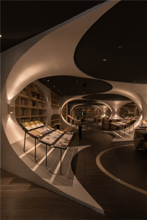 darkersolstice: archatlas: A Curved Library Reflected by the Floors Like Water Architecture firm XL-