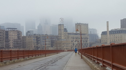 A runner is out training on a stormy afternoon in Minneapolis. (Presidents’ Day 2017)