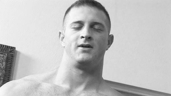 The O-face and other expressions caught on film: A black and white photo of a man achieving an orgasm. He has a very contemplative look on his face.