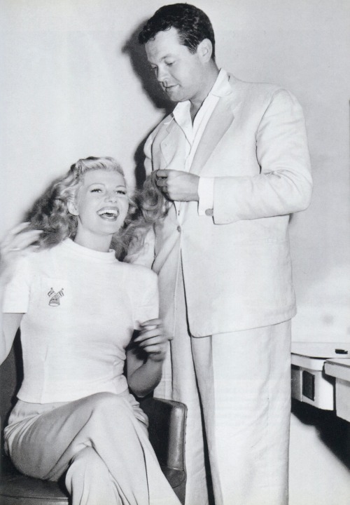 ladybegood:Orson Welles prepares to cut Rita Hayworth’s hair on the set of The Lady from Shanghai (1